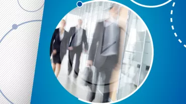 Blurred motion of business people walking in an office corridor.